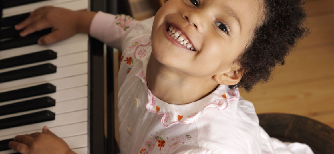 Young girl playing the piano